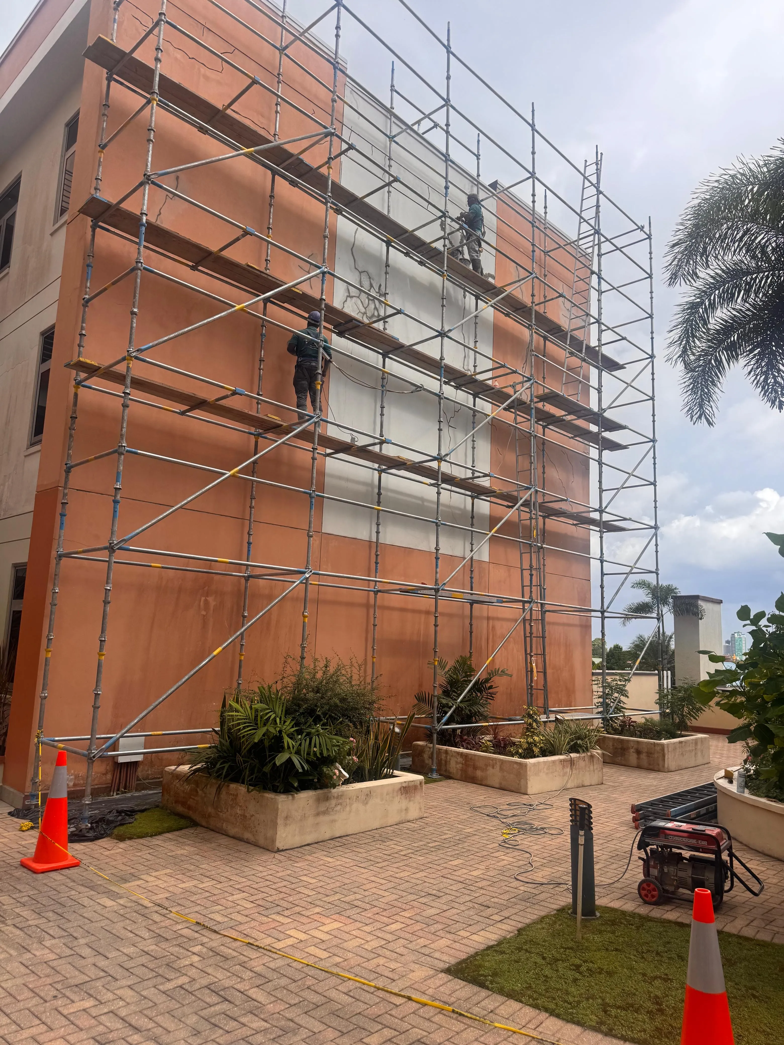 Exterior scaffold access and facade repair work in progress